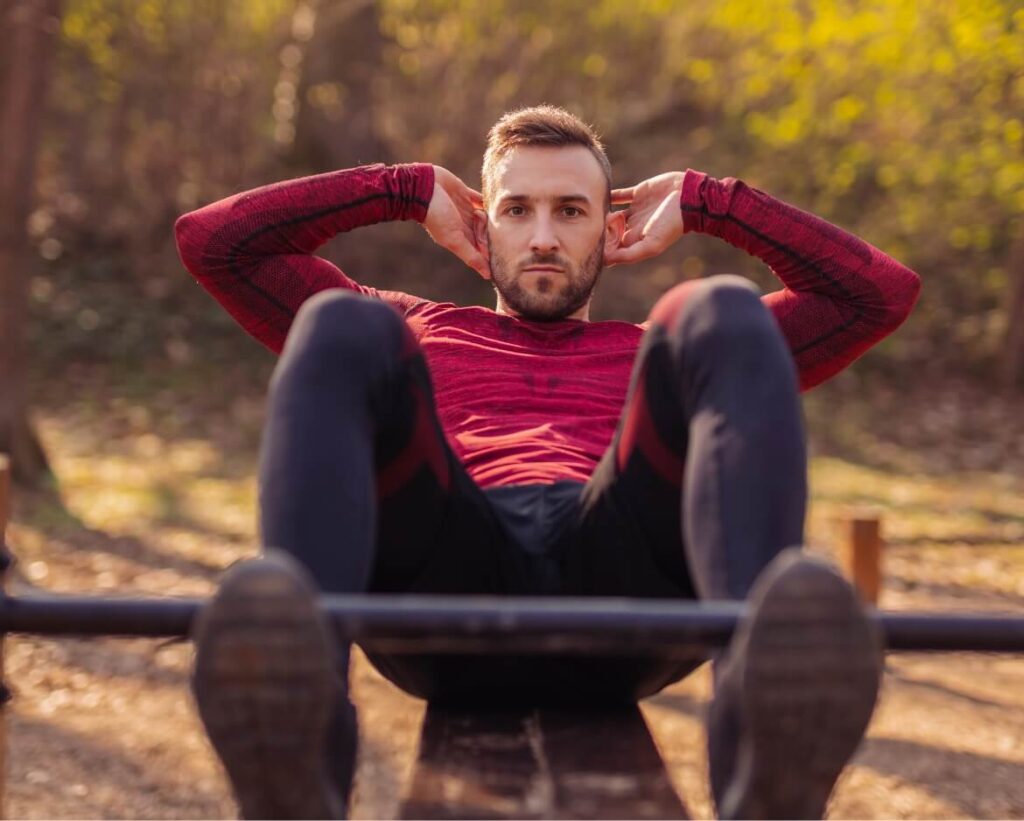active-man-working-out-outdoors-doing-crunches-2025-03-13-03-46-43-utc-2